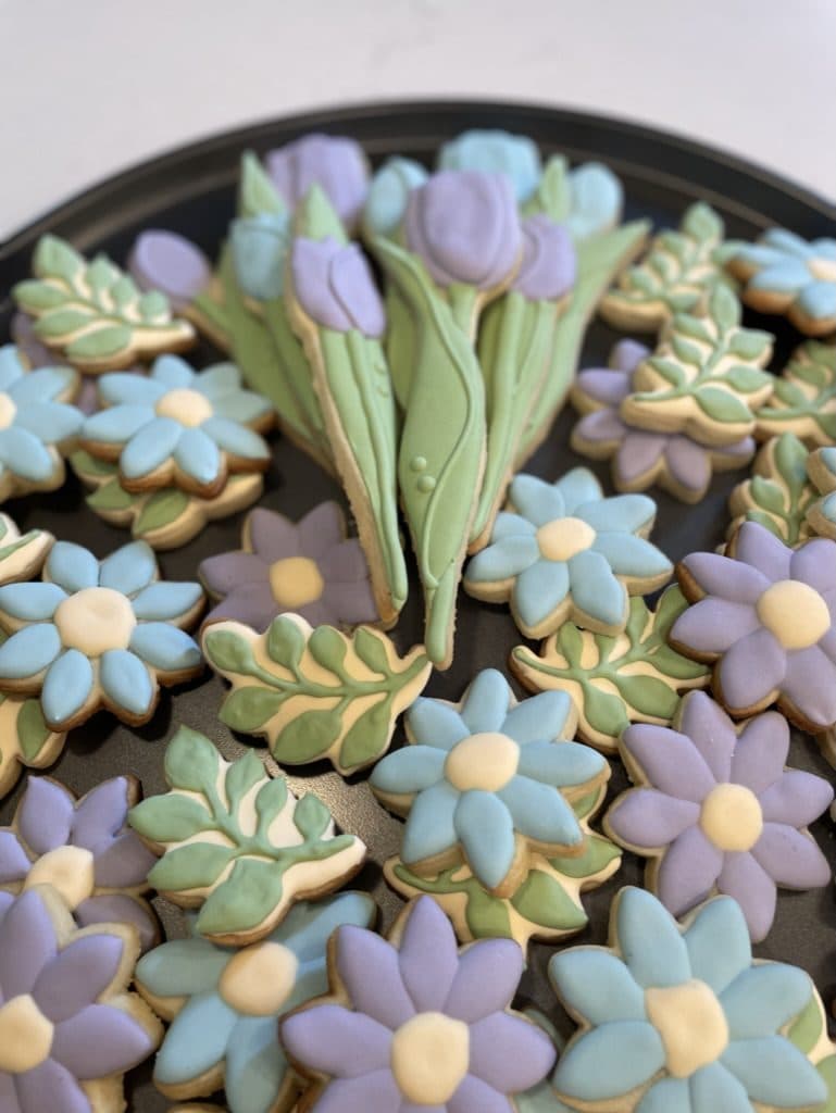 Platter of pastel flower and tulip cookies for a retirement party